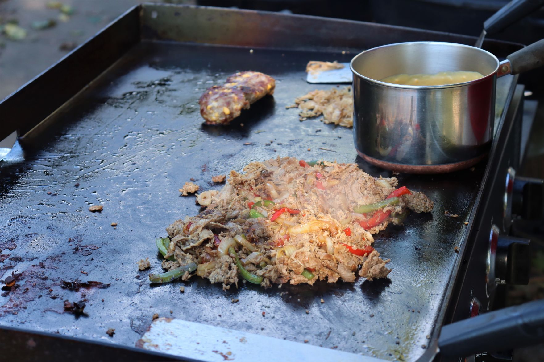 Blake Sykora preparing a Wisconsin cheese steak